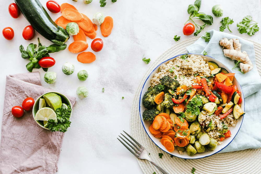Colorful vegetarian salad on plate – symbol of natural gut health and digestive wellness